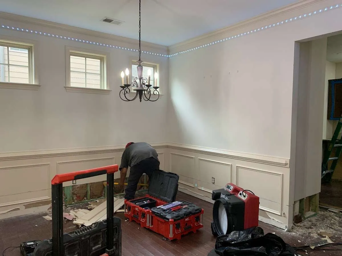 Restoration technician with professional equipment in Easton